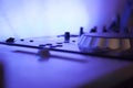 Close up of a music console equipment with blue led light