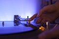 Close up of a music dj playing a vinilo needle