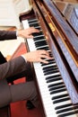 Handsome young men playing piano at the restaurante Royalty Free Stock Photo