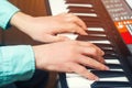 Close-up of a music performer`s hand playing the piano, man`s hand, classical music, keyboard, synthesizer, pianist Royalty Free Stock Photo
