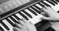 Close-up of a music performer`s hand playing the piano, man`s hand, classical music, keyboard, synthesizer, pianist Royalty Free Stock Photo