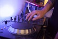 Close up of a music technician mixing tracks on his studio