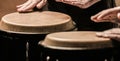 Close up of musician hand playing bongos drums. Afro Cuba, rum, drummer, fingers, hand, hit. Drum. Hands of a musician