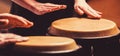 Close up of musician hand playing bongos drums. rum. Hands of a musician playing on bongs. The musician plays the bongo Royalty Free Stock Photo