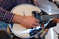 Close up of a musician playing Greek music on a Bouzouki