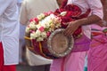 Musician playing with a Thavil during a Tamil procession