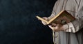 Close up of a Muslim man reading holy quran. Muslim mans hands praying and holding prayer beads. Written in Arabic, it means that Royalty Free Stock Photo