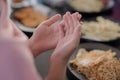 Close up of Muslim woman hand. Dua prayer for breaking fast and beginning fast. Food and water. Praying, Islam, Religion