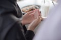 Close up of Muslim woman hand. Dua prayer for breaking fast and beginning fast. Food and water. Praying, Islam, Religion