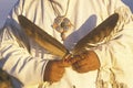 Close-up of a Native American holding ceremonial feathers, Big Sur, CA