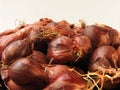 Close up of natural organic fresh raw red shallot onion isolated on white background.