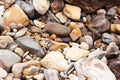 Close up of natural sea stones and pebbles rocks at the beach background. Royalty Free Stock Photo