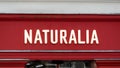 Close-up of a Naturalia sign. Naturalia is a French distribution chain specializing in organic products and fair trade