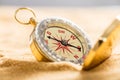 Compass On Sandy Beach