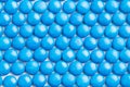 Close up neatly arranged blue milk chocolate candies crisp shell Royalty Free Stock Photo