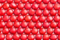 Close up neatly arranged red milk chocolate candies crisp shell Royalty Free Stock Photo