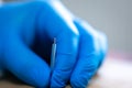 Close up of a needle and hands of physiotherapist doing a dry needling.