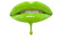 Close-up of neon green lip-gloss dripping from woman's lips over white background