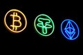 Close-up of neon signs in the form of logos of famous crypto-currencies on a dark background