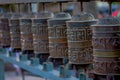 Close up of Nepalese religious carvings and prayer wheels at Swayambhu Temple also known as the Monkey Temple in Royalty Free Stock Photo