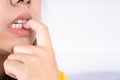 Close up nervous woman biting her nails, stressful woman gnawing her nails Royalty Free Stock Photo