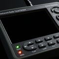 A close-up of a network cable tester features a dark screen and several labeled Royalty Free Stock Photo