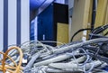 Close up network, fiber optic and telephone cables in big data center room. Network and telecommunication technology Royalty Free Stock Photo