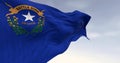 Close-up of Nevada state flag waving in the wind on a clear day