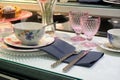 A close-up of the new autumn collection of ceramic tableware from the famous brand Villeroy & Boch, displayed in a window in a