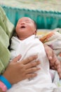 new born infant asleep in the blanket in delivery room Royalty Free Stock Photo