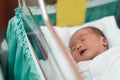 new born infant asleep in the blanket in delivery room Royalty Free Stock Photo