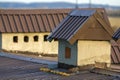 Close-up of a new built chimney on a house roof under construction. Unfinished building, repair and renovation work. Royalty Free Stock Photo