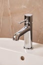 Close-up new chrome tap or faucet in the bathroom. Royalty Free Stock Photo