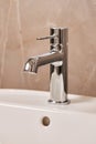 Close-up new chrome tap or faucet in the bathroom. Royalty Free Stock Photo