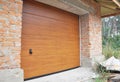 Close up on new installed garage door boards in brick wall house construction. Royalty Free Stock Photo