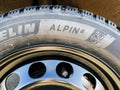 Close-up of new Michelin Alpin 6 Premium touring winter tyre mounted on a new