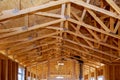 Close-up new stick built home under construction under blue sky Framing structure wood frame of wooden houses home Royalty Free Stock Photo