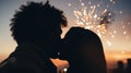 Close-up of a New Year's kiss, blurred background of fireworks in the sky. Silhouette of a loving couple.