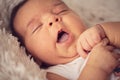 Close up of newborn baby body parts. Small hand, nose and mouth Royalty Free Stock Photo