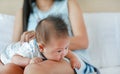 Close up newborn baby boy lying on mother legs Royalty Free Stock Photo