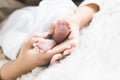 Close up newborn baby `s foot in mother `s hand. Mother `s day concept Royalty Free Stock Photo