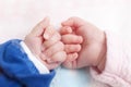 Close up of newborn twins hands
