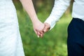 Close-up of newly weds holding each other`s hands and showing their wedding rings Royalty Free Stock Photo