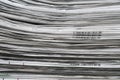 Newspapers folded and stacked background and texture