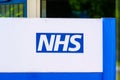 A close-up of the NHS - National Health Service logo