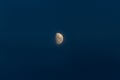 Close up of nice crescent moon on a dark blue sky. Stock photo of the details of the moon in the blue hour Royalty Free Stock Photo