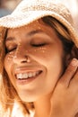 Close-up of nice young caucasian girl smiling with her eyes closed basking in sun. Royalty Free Stock Photo