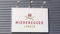 Close up of Niederegger LÃÂ¼beck sign at the facade of the headquarter in LÃÂ¼beck.