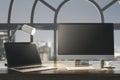 Close up of night designer desk top with empty laptop computer screens, coffee cup and keyboard on wooden desktop and window with Royalty Free Stock Photo