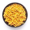 Close up of Nimbu masala besan sev Indian namkeen snacks on a ceramic black bowl.